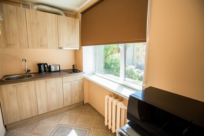 Imagen de la habitación del Hotel City Inn Apartments. Foto 9