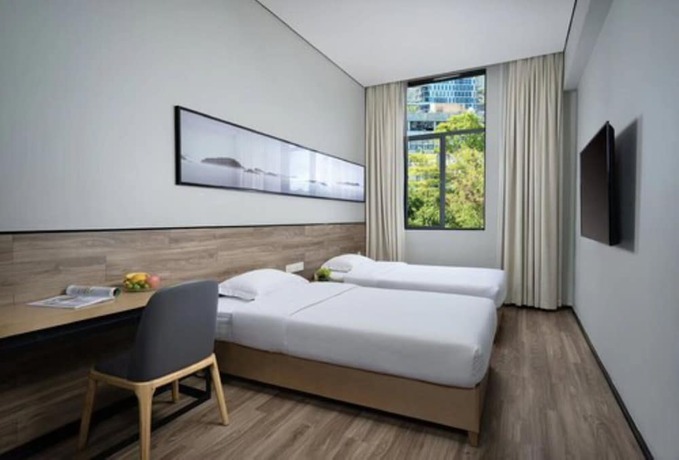 Imagen de la habitación del Hotel City Inn Oct Loft Branch. Foto 11