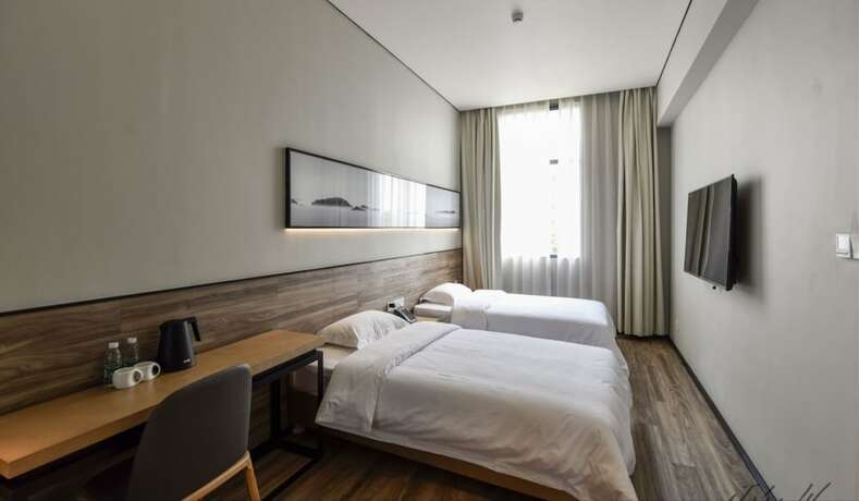 Imagen de la habitación del Hotel City Inn Oct Loft Branch. Foto 13