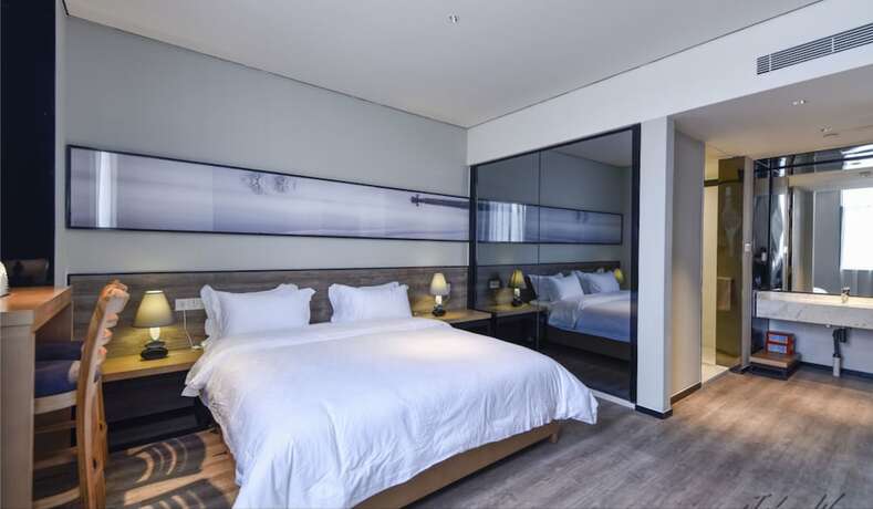 Imagen de la habitación del Hotel City Inn Oct Loft Branch. Foto 14