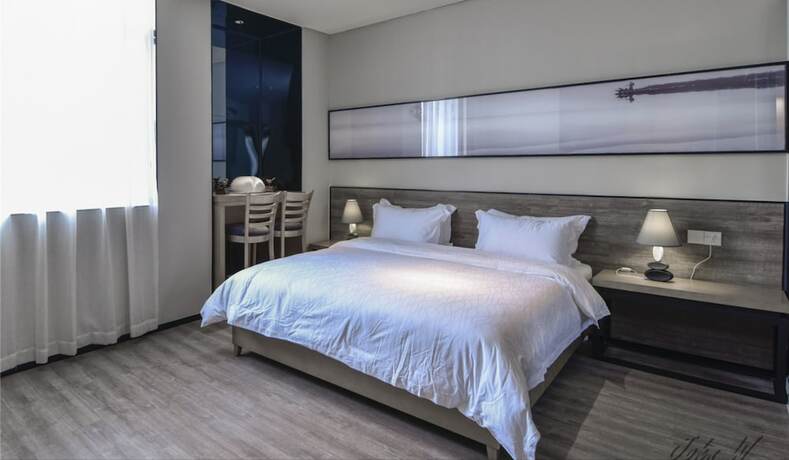 Imagen de la habitación del Hotel City Inn Oct Loft Branch. Foto 15