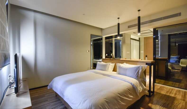Imagen de la habitación del Hotel City Inn Oct Loft Branch. Foto 16