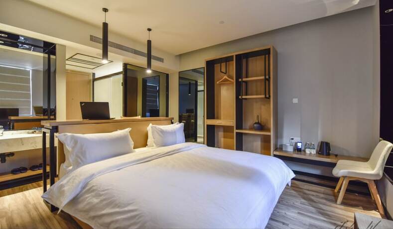 Imagen de la habitación del Hotel City Inn Oct Loft Branch. Foto 17