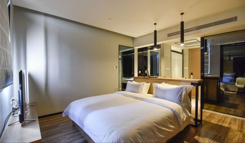 Imagen de la habitación del Hotel City Inn Oct Loft Branch. Foto 18