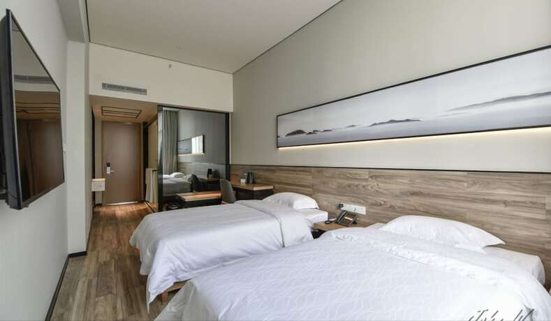 Imagen de la habitación del Hotel City Inn Oct Loft Branch. Foto 21