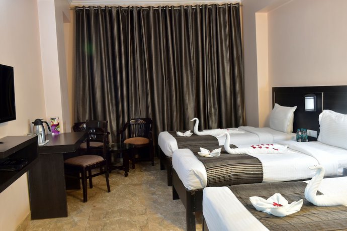 Imagen de la habitación del Hotel City Inn Varanasi. Foto 9