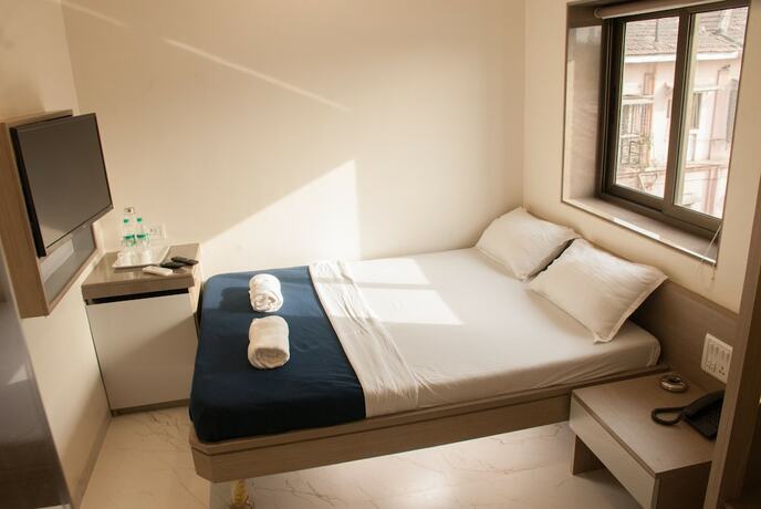 Imagen de la habitación del Hotel City, Mumbai. Foto 15