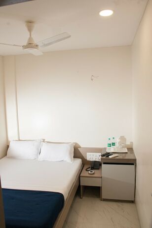 Imagen de la habitación del Hotel City, Mumbai. Foto 16