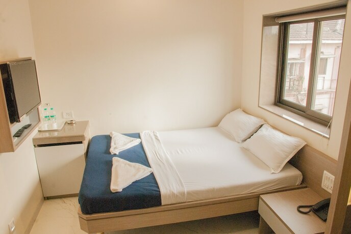 Imagen de la habitación del Hotel City, Mumbai. Foto 19