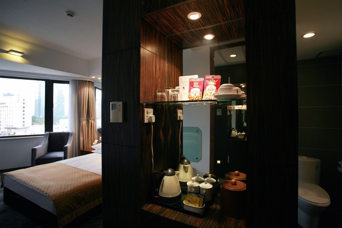 Imagen de la habitación del Hotel City Shanghai. Foto 12