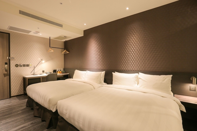 Imagen de la habitación del Hotel City Suites Taipei Nandong. Foto 3