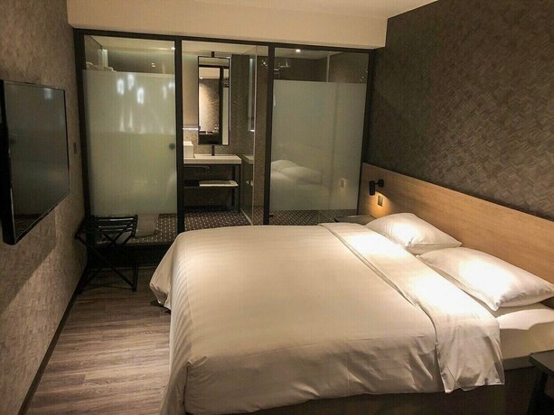 Imagen de la habitación del Hotel City Suites Taoyuan Station. Foto 14