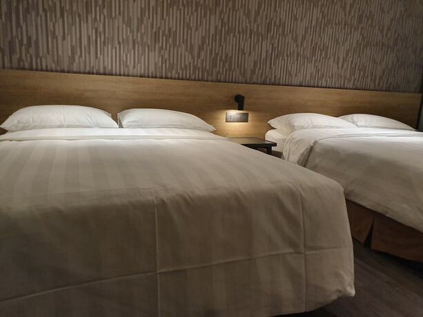 Imagen de la habitación del Hotel City Suites Taoyuan Station. Foto 16