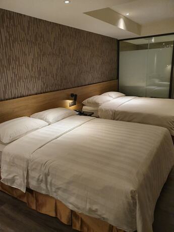 Imagen de la habitación del Hotel City Suites Taoyuan Station. Foto 17