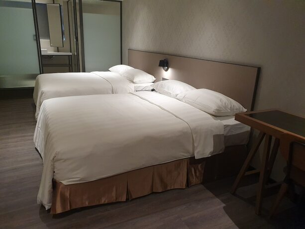 Imagen de la habitación del Hotel City Suites Taoyuan Station. Foto 18