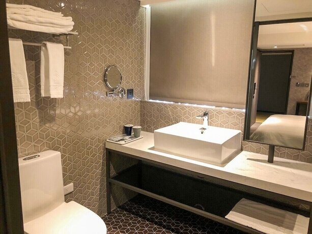 Imagen de la habitación del Hotel City Suites Taoyuan Station. Foto 21