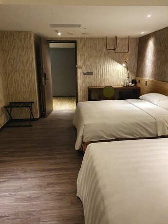 Imagen de la habitación del Hotel City Suites Taoyuan Station. Foto 23
