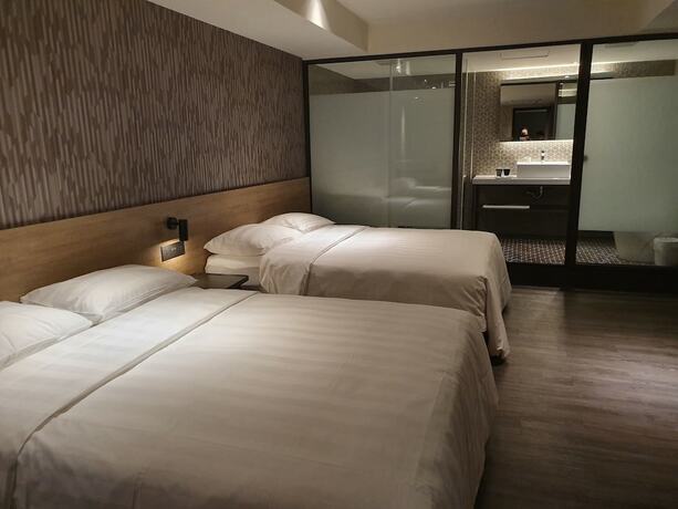 Imagen de la habitación del Hotel City Suites Taoyuan Station. Foto 24