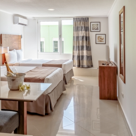 Imagen de la habitación del Hotel City Suites and Beach. Foto 10