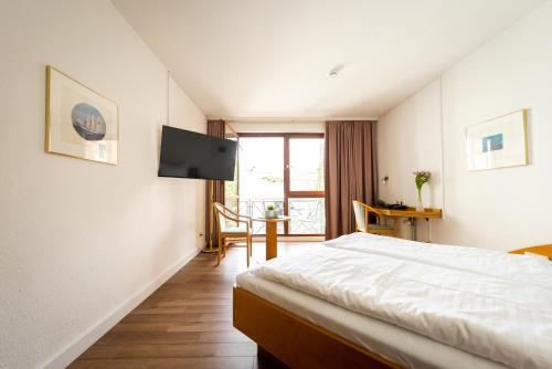 Imagen de la habitación del Hotel CityHotel Feuerbach. Foto 9