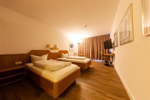 Imagen de la habitación del Hotel CityHotel Feuerbach. Foto 11