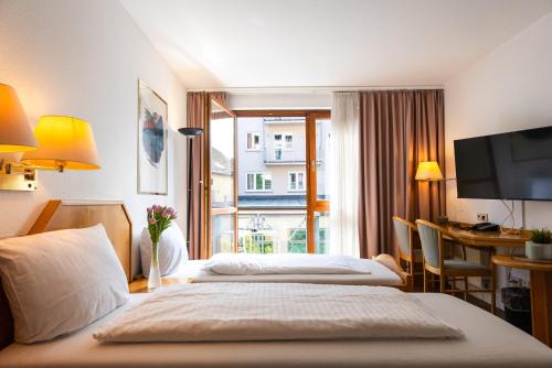 Imagen de la habitación del Hotel CityHotel Feuerbach. Foto 12