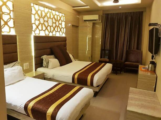 Imagen de la habitación del Hotel Cj International. Foto 15