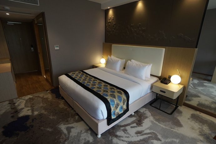 Imagen de la habitación del Hotel Clarks Inn suites Raipur. Foto 7