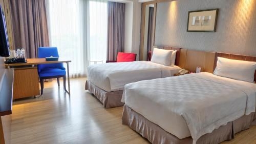Imagen de la habitación del Hotel Claro Makassar. Foto 9