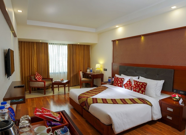 Imagen de la habitación del Hotel Classic Sarovar Portico Trivandrum. Foto 2