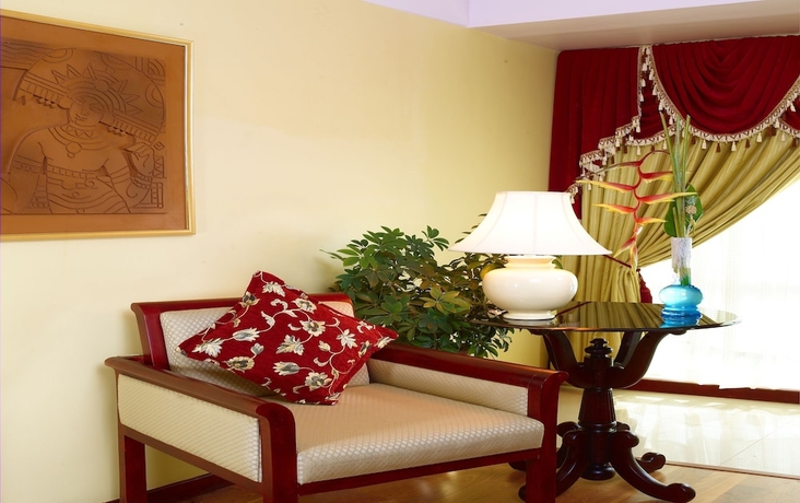 Imagen de la habitación del Hotel Classic Sarovar Portico Trivandrum. Foto 4