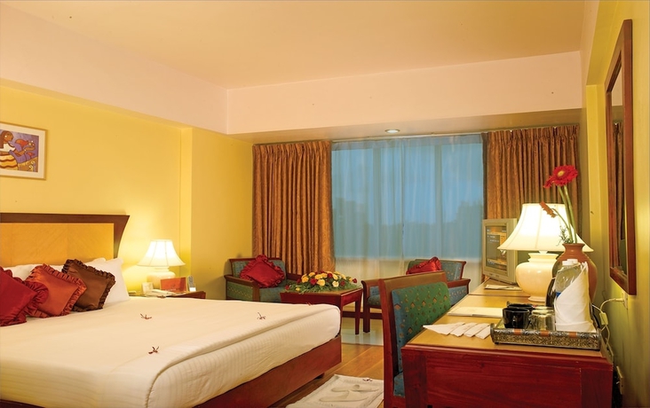 Imagen de la habitación del Hotel Classic Sarovar Portico Trivandrum. Foto 7