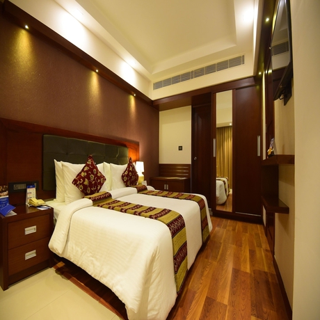 Imagen de la habitación del Hotel Classic Sarovar Portico Trivandrum. Foto 9