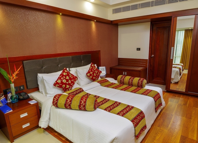 Imagen de la habitación del Hotel Classic Sarovar Portico Trivandrum. Foto 10