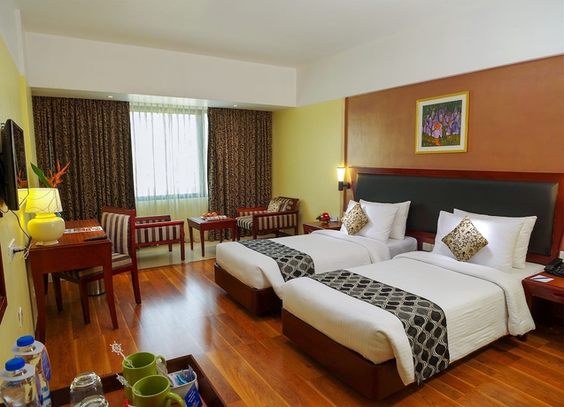 Imagen de la habitación del Hotel Classic Sarovar Portico Trivandrum. Foto 12