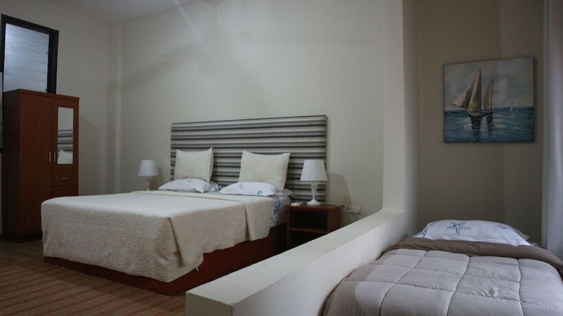 Imagen de la habitación del Hotel Cliff Haven Beach Resort. Foto 14