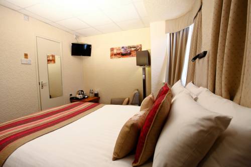 Imagen de la habitación del Hotel Clifton Court Metro. Foto 14