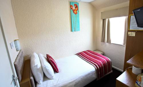 Imagen de la habitación del Hotel Clifton Court Metro. Foto 16