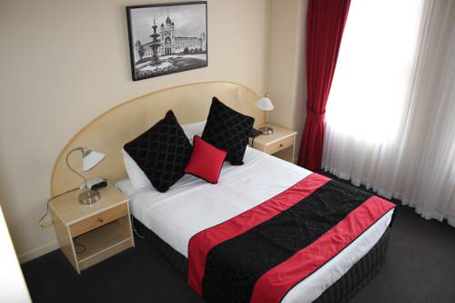 Imagen de la habitación del Hotel Clocktower Apartment. Foto 1