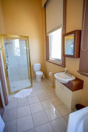 Imagen de la habitación del Hotel Clocktower Suites. Foto 26