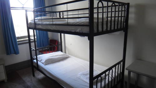 Imagen de la habitación del Hotel Clover Backpackers. Foto 1