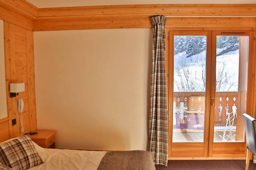 Imagen de la habitación del Hotel Club Le Crêt. Foto 8