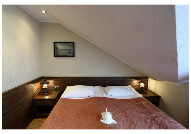 Imagen de la habitación del Hotel Club Marinn Mini-hotel. Foto 4