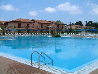 Imagen de la piscina del Hotel Club Porto Ada. Foto 5
