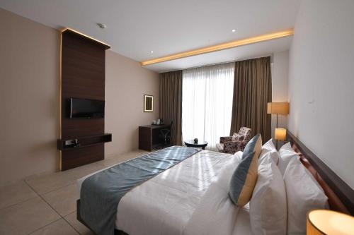Imagen de la habitación del Hotel Clubhouse Morbi, Lalpar. Foto 16