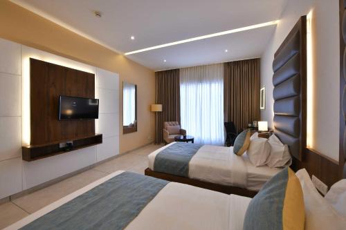 Imagen de la habitación del Hotel Clubhouse Morbi, Lalpar. Foto 18
