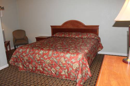 Imagen de la habitación del Hotel Coach N Four. Foto 4