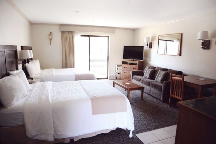 Imagen de la habitación del Hotel Coachman Inn And Suites. Foto 11