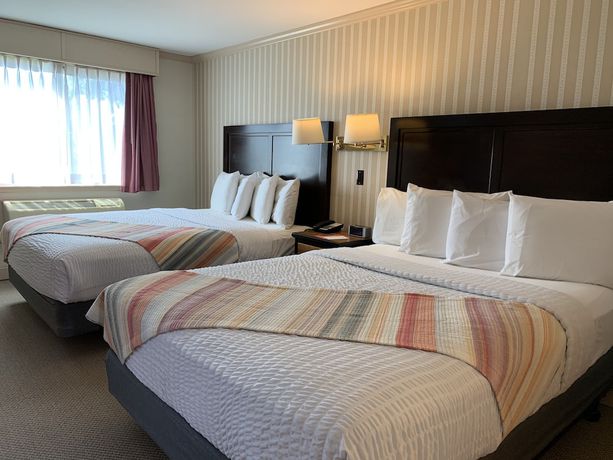 Imagen de la habitación del Hotel Coachman Inn And Suites. Foto 12