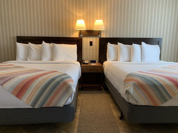 Imagen de la habitación del Hotel Coachman Inn And Suites. Foto 13